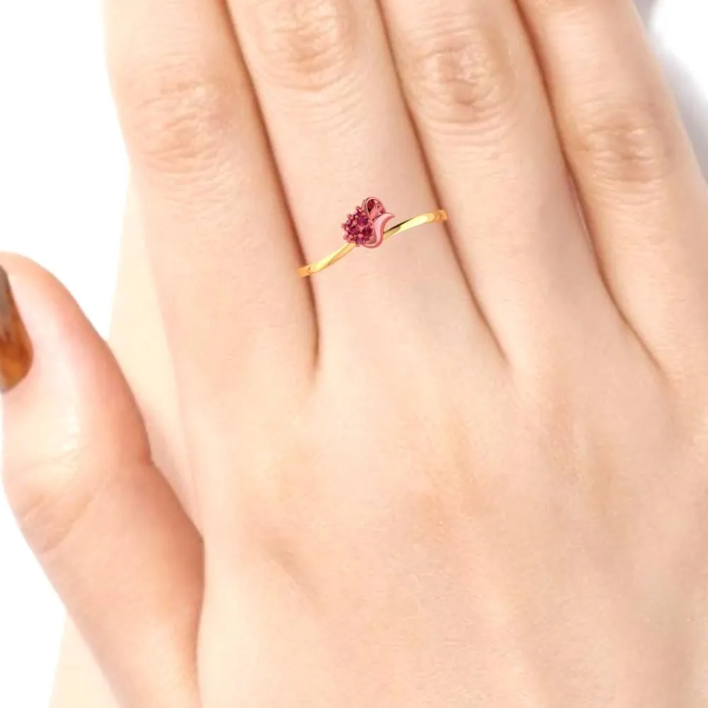 A Ring Made Of 22k Gold Featuring A Yellow Pattern And Red Stones