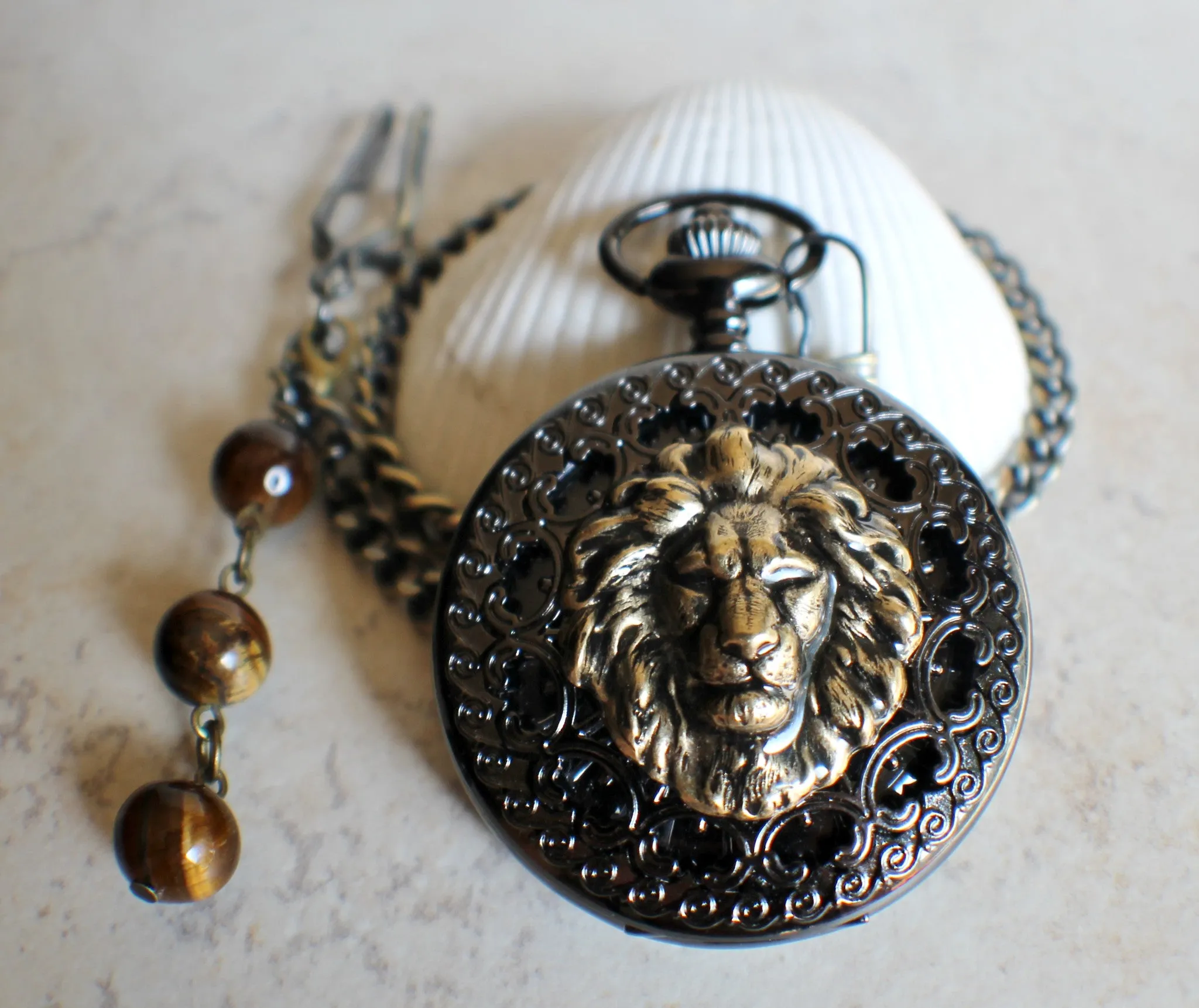 Bronze lion pocket watch, mechanical pocket watch in black.