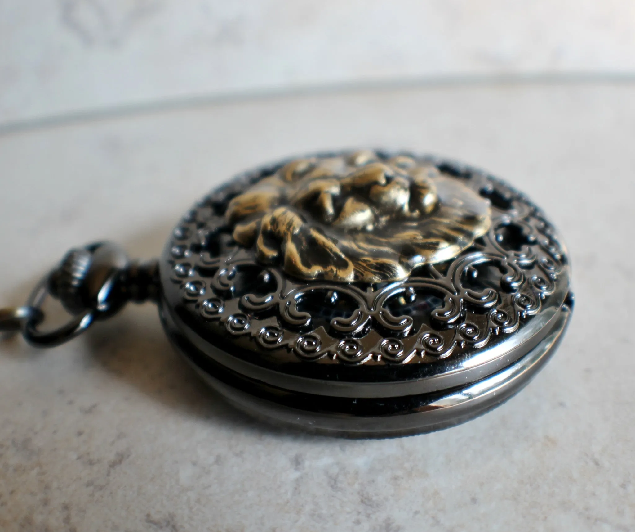 Bronze lion pocket watch, mechanical pocket watch in black.