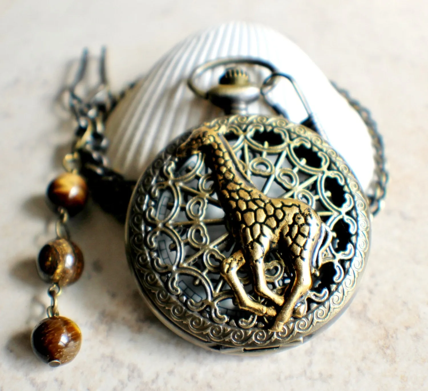 Giraffe battery operated pocket watch in bronze.