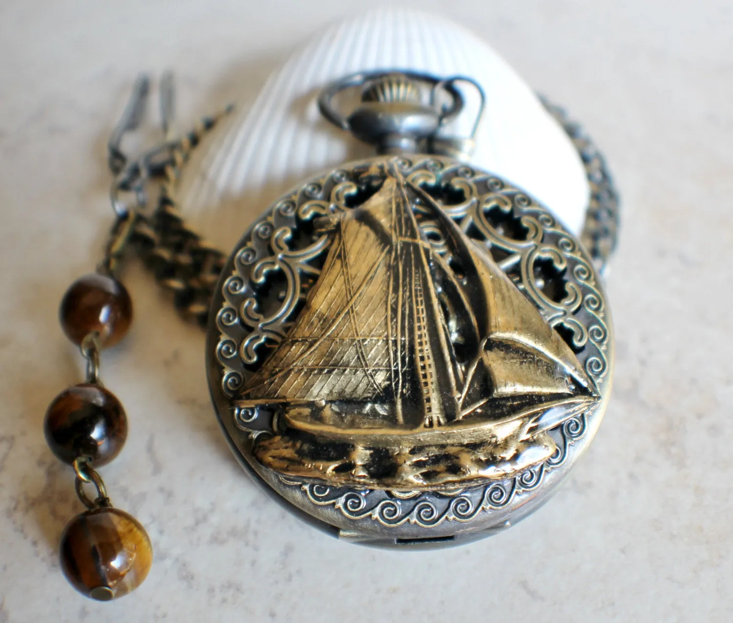 Nautical battery operated pocket watch with sailboat