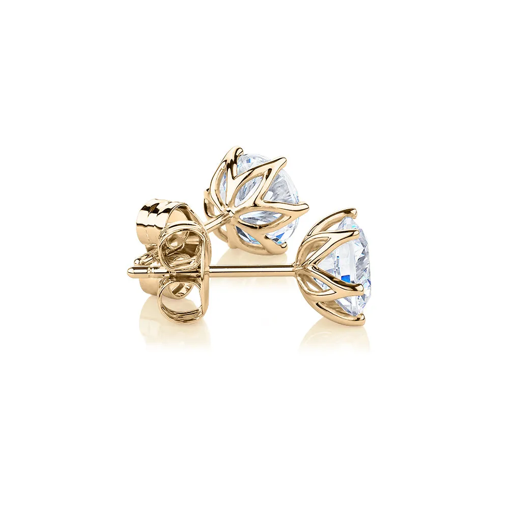 Round Brilliant stud earrings with 2 carats* of diamond simulants in 10 carat yellow gold