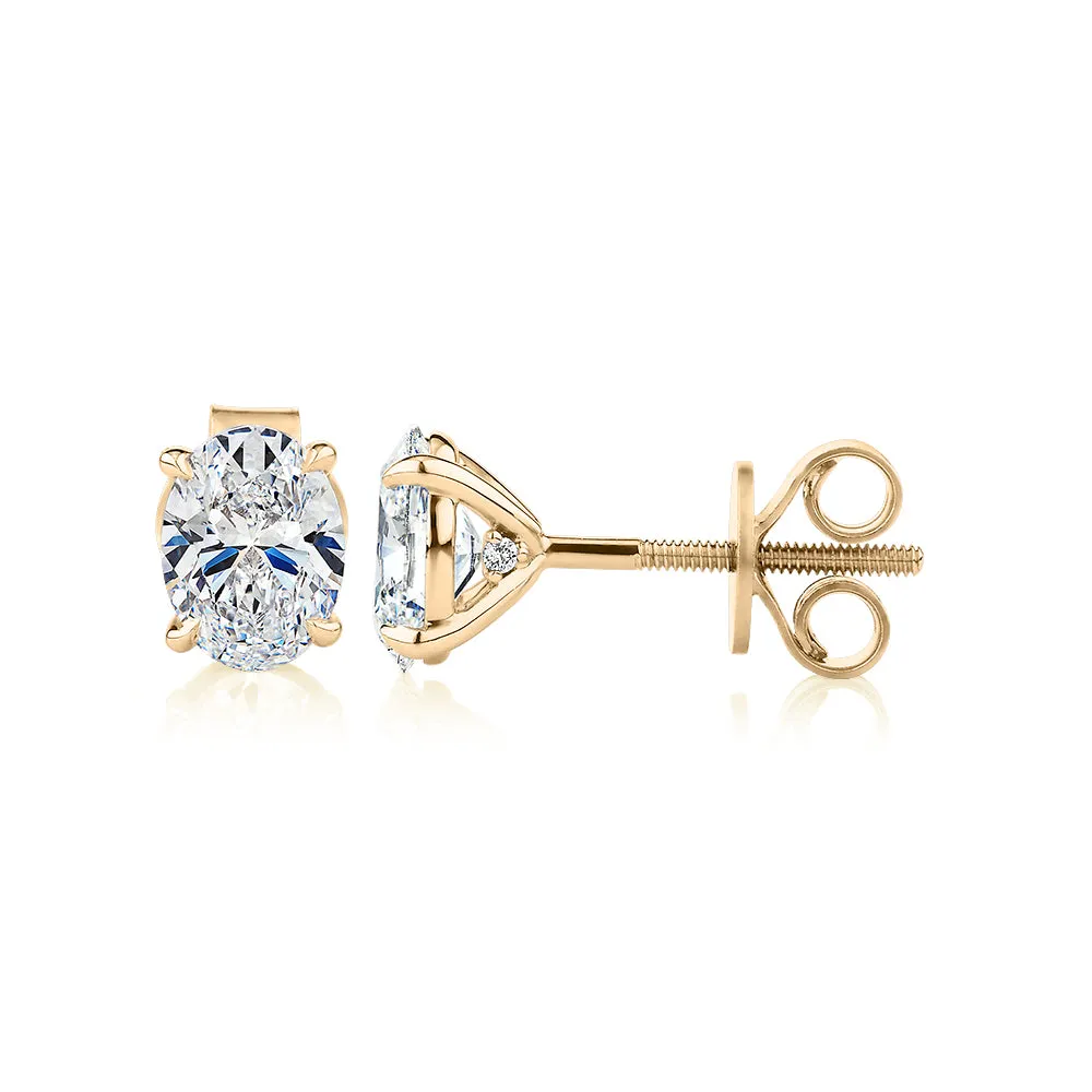 Signature Simulant Diamond 1.40 carat* TW oval stud earrings in 14 carat yellow gold