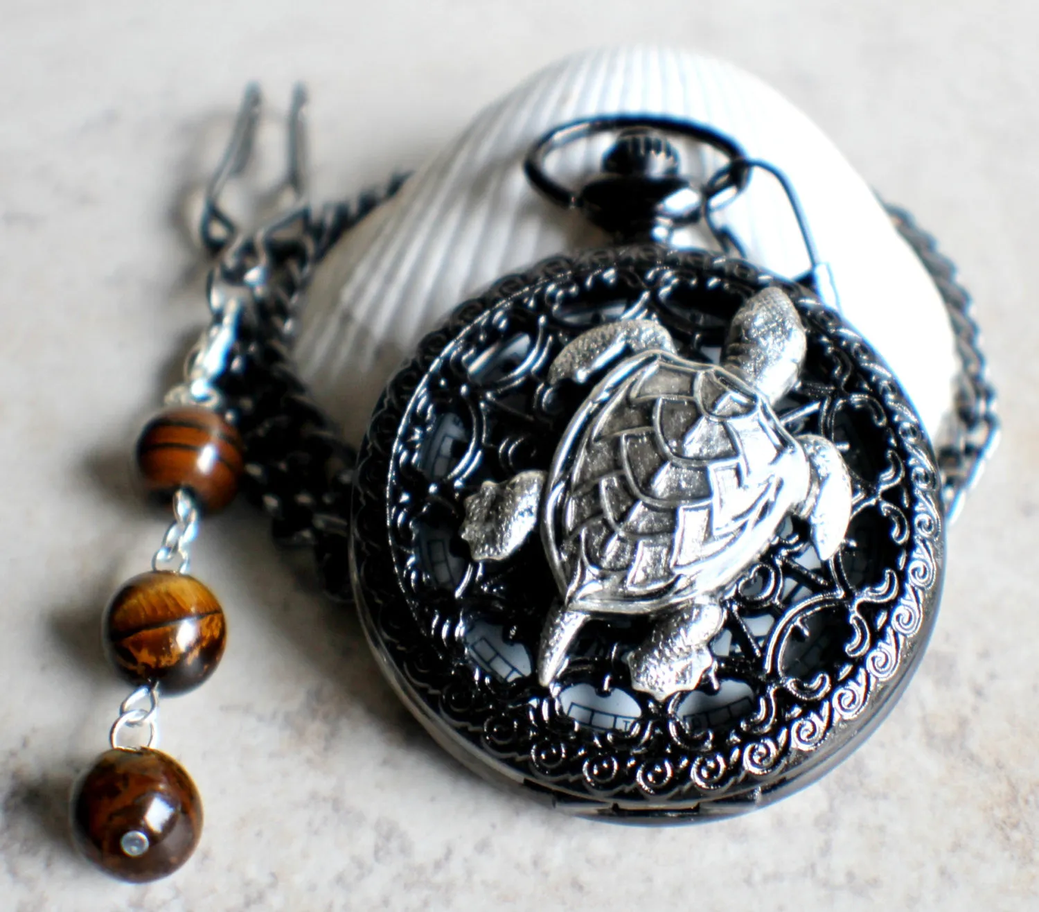 Turtle pocket watch battery operated in black.