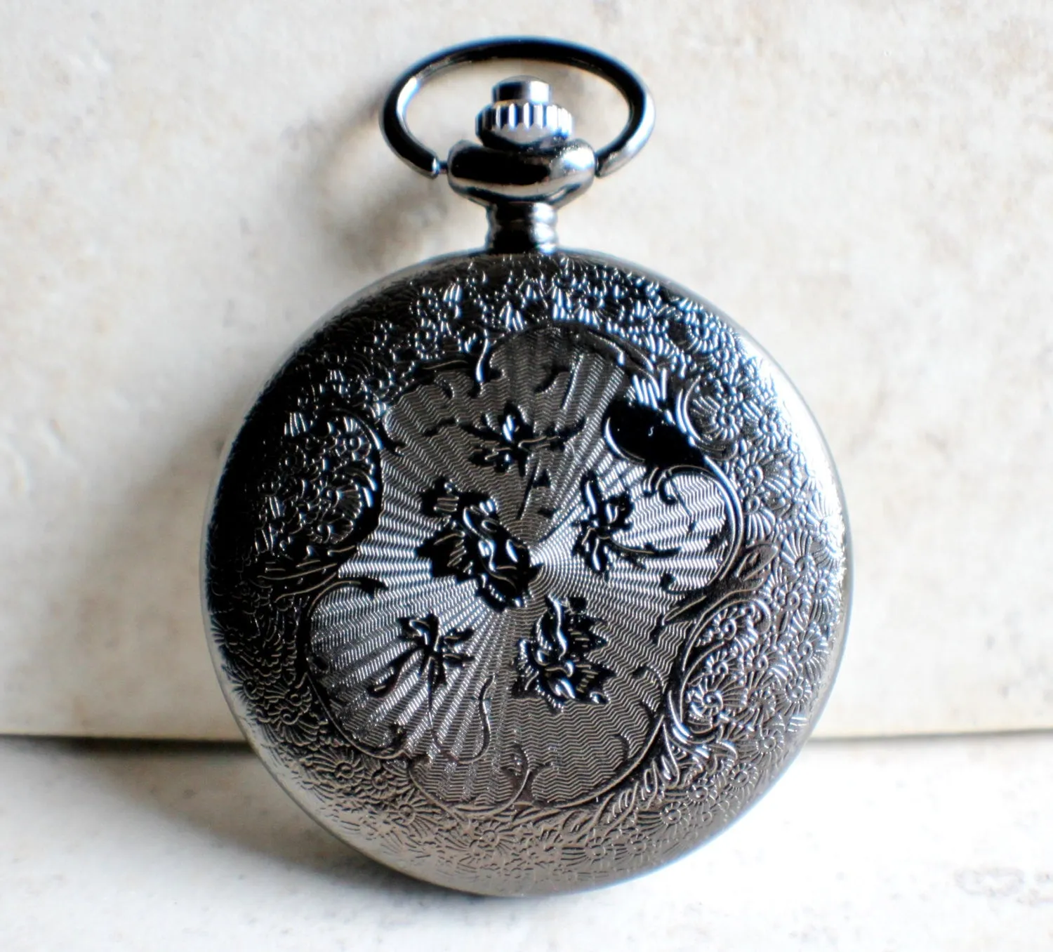 Turtle pocket watch battery operated in black.